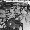 Excavation photograph : south range - room 3 paved floor, from east.