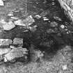 Excavation photograph : east range - room 2 floor, from south.