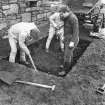 Excavation photograph : outside palace, men digging septic tank, from north-west.