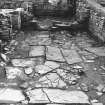 Excavation photograph : south range - room 3, from west.