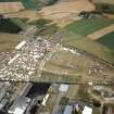 An oblique aerial view of the Black Isle Showground, Muir of Ord, Urray, Ross and Cromarty, looking NE.