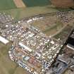 An oblique aerial view of the Black Isle Showground, Muir of Ord, Urray, Ross and Cromarty, looking SE.