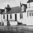 General view of nos. 75-79 Main Street, Glenluce, from SE.