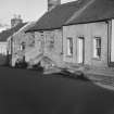 General view of nos. 10, 12 High Street, Whithorn, from south.