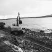 Construction Photograph: Coastal restorative work to build a breakwater for the future protection of Jarlshof.
Armoury around sea side of beach access road W-E.