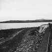 Construction Photograph: Coastal restorative work to build a breakwater for the future protection of Jarlshof.
Access road on beach E-W.