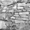 Construction Photograph: Coastal restorative work to build a breakwater for the future protection of Jarlshof.
Join between armour and hand-built walls S-N.