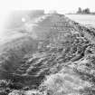 Construction Photograph: Construction of breakwater.