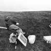 Photograph of member of archaeological team.