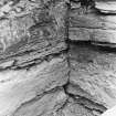 Excavation photograph. Corner of interior.