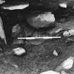 Excavation photograph : trench H - showing hearth upright L386 and slabs L387.

(see MS/682/120 for detailed description)