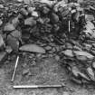 Excavation photograph : Trench K - detail after removal of rubble, revealing buttress overlying free standing part of rampart facing wall.

(see MS 682/121 for detailed description)