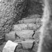 Excavation photograph: Containing wall that surrounds north east side of chamber.