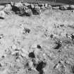 Excavation photograph : Hut Circle I - NE sector, wall with post holes.