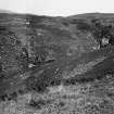 Excavation photograph : Kilphedir glen with tent marking location of hut circles and arable land.