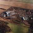 Oblique aerial view of Edinburgh centred on the Royal Infirmary of Edinburgh at Little France under construction. 