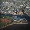 Oblique aerial view showing the boat yard and whisky distillery, Dumbarton