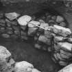 Excavation photograph : alcove in SW wall of souterrain with blocking.
