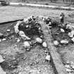 Films 3000-3003: burial cairn 1 under excavation (site 20).