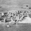 Excavation photograph : view of wheelhouses and hut, to NW.