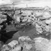 Excavation photograph : hearth with kerb of jawbones in central area of larger wheelhouse.