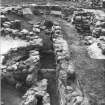 Excavation photograph : view, from east, of north end of furnace, cell and entrance passage and wheelhouse.