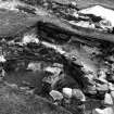 Excavation photograph : view over smaller wheelhouse, with entrance passage beyond.