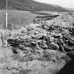 Excavation photograph showing exposed timbers in area LM89