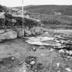 Excavation photograph showing working area looking north - hearth and stake holes in area L-89
Duplicate photographic print available in MS/1179/1