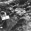 Excavation photographs showing excavation team at work - volunteers drawing final plans of fort in wet and wintry conditions.
M-9 entrance in background

