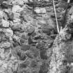 Excavation photograph showing wall section,  level layer

