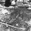 Excavation photograph showing timber floor in entrance way

