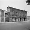 General view of front of building, Town Hall, Castle Street, Banff, showing the premises of D W Innes, butcher and Jas. Wilson, fancy goods and draper.