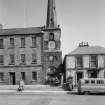 General view of town house, tolbooth steeple and 32 Low Street, Banff, from west.