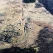 Oblique aerial view of Glen Muick centred on the remains of a township, rig and head-dyke, taken from the NW