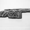E29  Piece of carved wood.