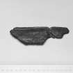 E29  Piece of carved wood.