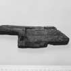 E29  Piece of carved wood.