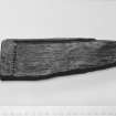 E29  Piece of carved wood.