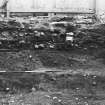 Excavation photograph : Area 1, east facing section, cellar 1.