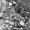 Excavation photograph : Area 4, - hearth  422 in excavation, looking west.