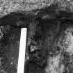 Excavation photograph : Architectural fragment (since lost) 142, looking east.