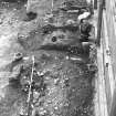 Excavation photograph : Road and sillbeam wall 728, looking south.