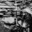 Excavation photograph : Fort wall face on trench facing south and cemetry.