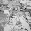 Excavation photograph : Grave I over cell in fort wall.