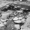 Excavation photograph : interior of enclosure I, with stone box which formed part of Grave III.