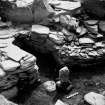 Excavation photograph : a cell in a legth of walling below the level of enclosure I, and to the east of the broch.