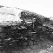 Trench 1, Area A, Extension.  Lower walls (Features 3 and 4) and midden (Feature 2) in section, Looking towards Trench 2.  From North-East.