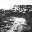 Excavation photograph - trench 1, area A, extension showing outer face of N wall of outbuilding, from N.
Photographic copy of polaroid print. Copied 1995.