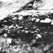 Excavation photograph -  Trench 1, area A, extension - F3 and 4 at their E extent, from NW.
Photographic copy of polaroid print. Copied 1995.